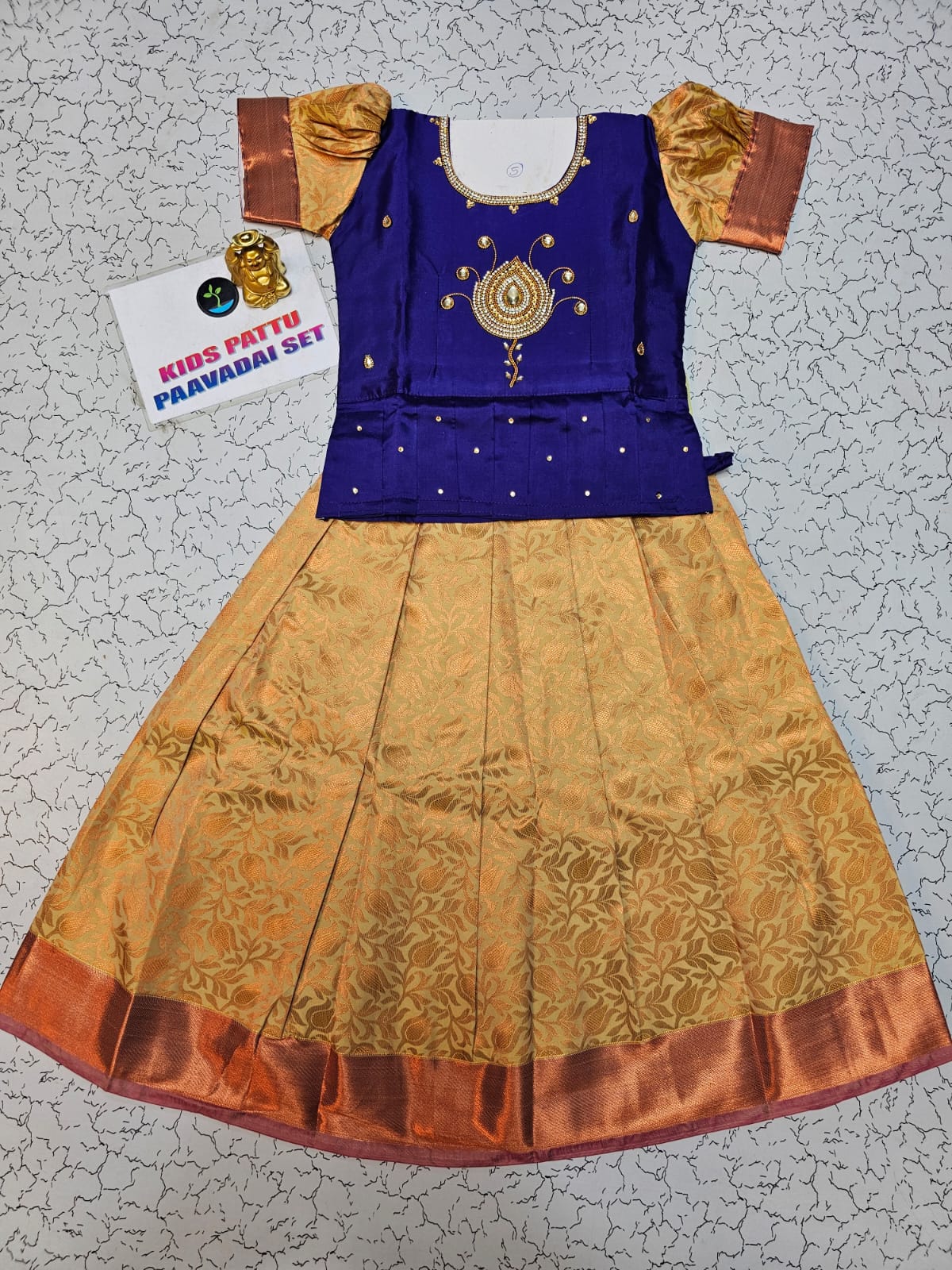 Little girl wearing royal blue and golden pattu pavadai set with puff sleeves and zari silk skirt – Sri Thulir Tex