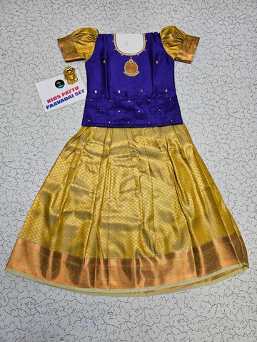 Kids Pattu Pavadai set with royal blue stone-work top and golden zari woven skirt from Sri Thulir Tex.