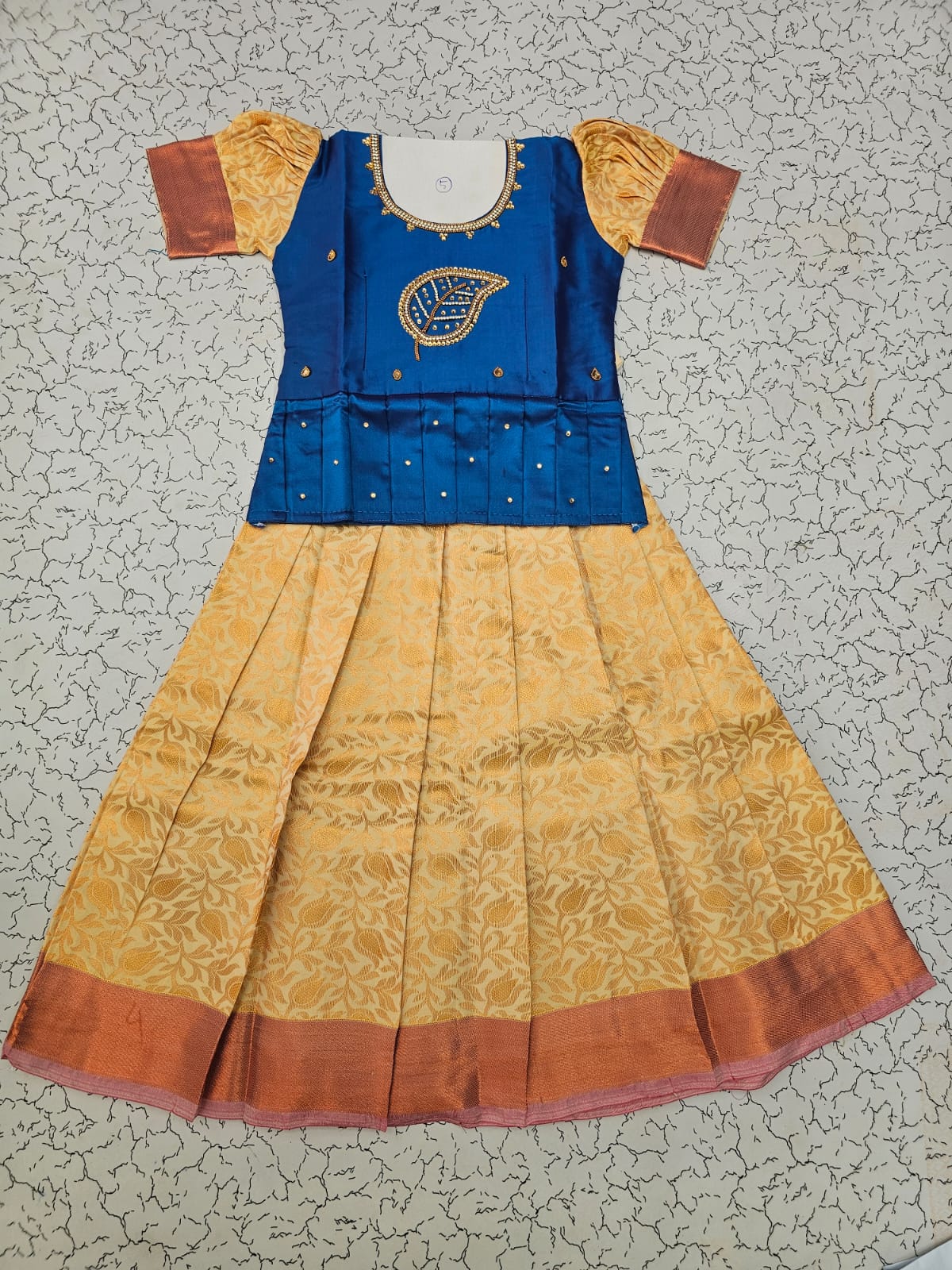 Kids pattu pavadai set with blue semi silk top and cream bridal silk skirt by Sri Thulir Tex