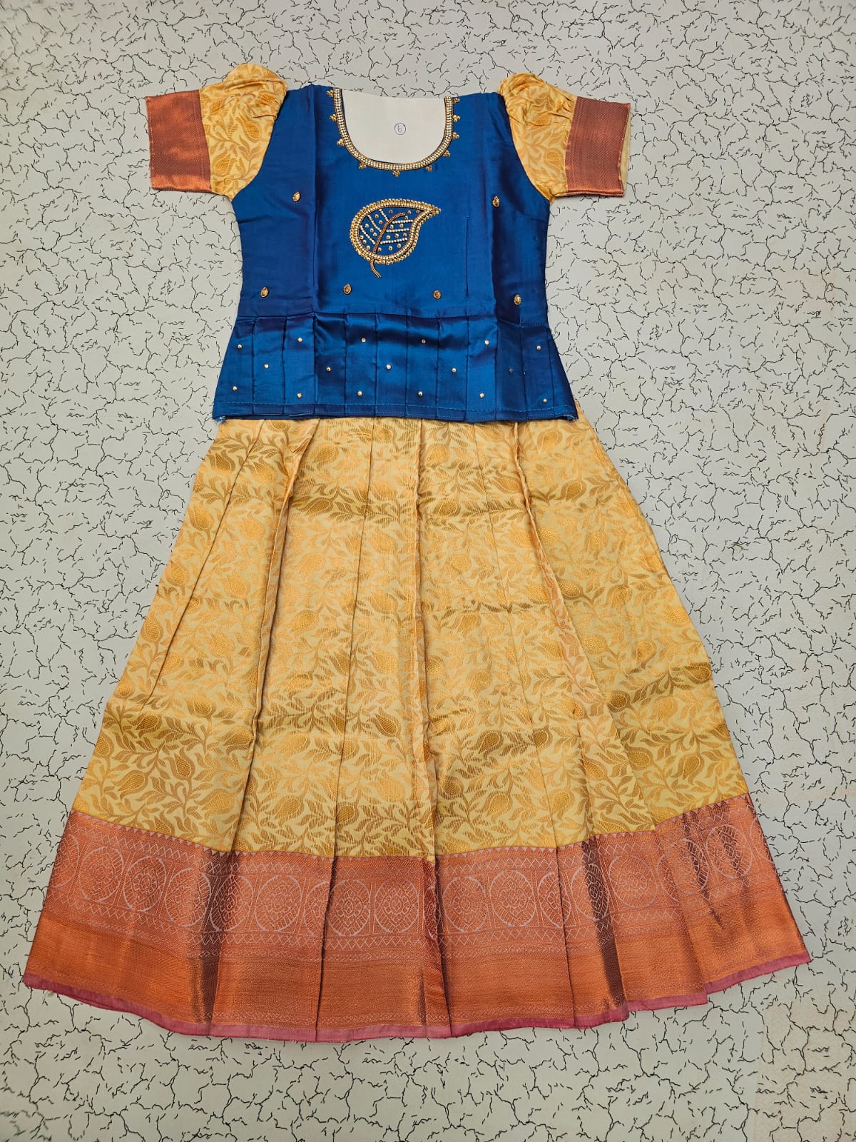 Kids pattu pavadai set with blue semi silk top and cream bridal silk skirt by Sri Thulir Tex