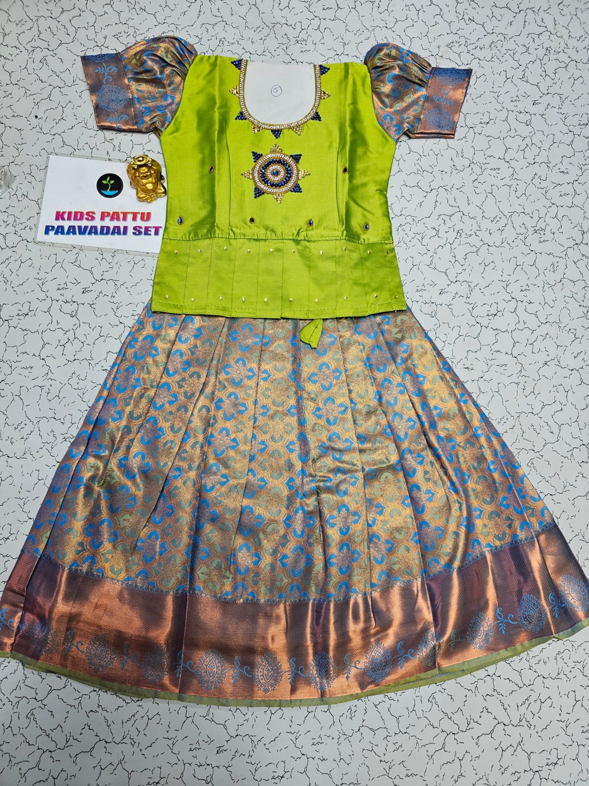 Kids pattu pavadai set with green semi silk top and blue bridal silk skirt by Sri Thulir Tex