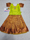 Kids pattu pavadai set with green semi silk top and gold bridal silk skirt by Sri Thulir Tex