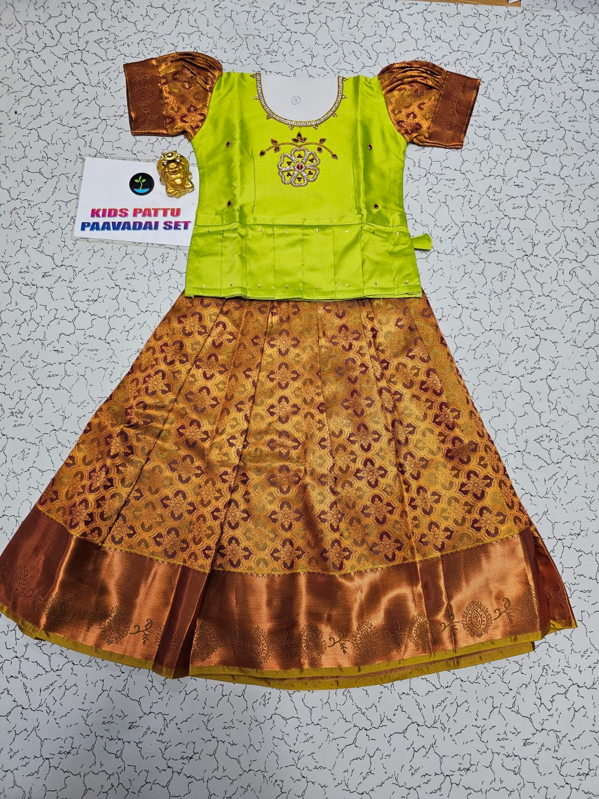 Kids pattu pavadai set with green semi silk top and gold bridal silk skirt by Sri Thulir Tex