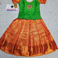 Kids pattu pavadai set with green semi silk top and orange bridal silk skirt by Sri Thulir Tex