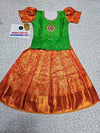 Kids pattu pavadai set with green semi silk top and orange bridal silk skirt by Sri Thulir Tex