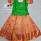 Kids pattu pavadai set with green semi silk top and peach-gold bridal silk skirt by Sri Thulir Tex