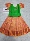 Kids pattu pavadai set with green semi silk top and peach-gold bridal silk skirt by Sri Thulir Tex