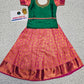 Kids green and pink pattu pavadai set with silk skirt and embroidered stonework blouse