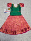 Kids green and pink pattu pavadai set with silk skirt and embroidered stonework blouse