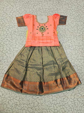 Kids pattu pavadai set with peach semi silk top and green bridal silk skirt by Sri Thulir Tex