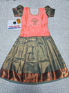 Kids pattu pavadai set with peach semi silk top and green bridal silk skirt by Sri Thulir Tex