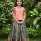 Kids pattu pavadai set with peach semi silk top and green bridal silk skirt by Sri Thulir Tex