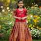 Kids pattu pavadai set with pink semi silk top and gold bridal silk skirt by Sri Thulir Tex