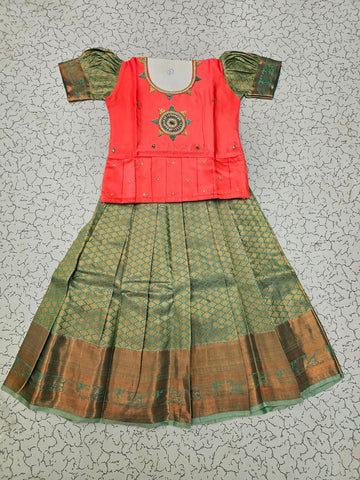 Kids pattu pavadai set with pink semi silk top and green bridal silk skirt by Sri Thulir Tex