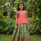 Kids pattu pavadai set with pink semi silk top and green bridal silk skirt by Sri Thulir Tex