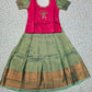 Kids pattu pavadai set with pink semi silk top and green bridal silk skirt by Sri Thulir Tex