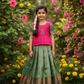 Kids pattu pavadai set with pink semi silk top and green bridal silk skirt by Sri Thulir Tex