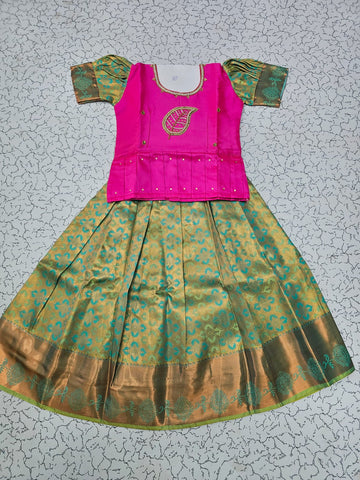 Kids pattu pavadai set with pink semi silk top and green bridal silk skirt by Sri Thulir Tex