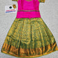Kids pink blouse and green silk pattu pavadai set with stonework and puff sleeves