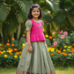 Kids pattu pavadai set with pink semi silk top and green bridal silk skirt by Sri Thulir Tex