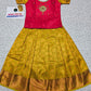 Kids pattu pavadai set with pink semi silk top and yellow bridal silk skirt by Sri Thulir Tex