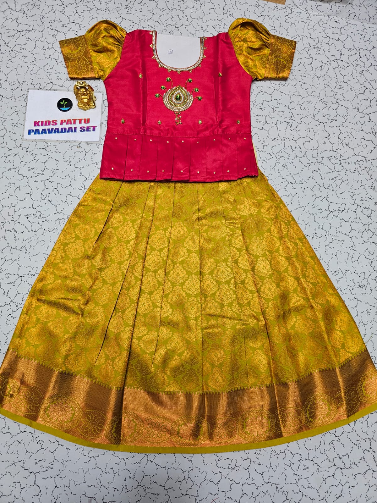 Kids pattu pavadai set with pink semi silk top and yellow bridal silk skirt by Sri Thulir Tex