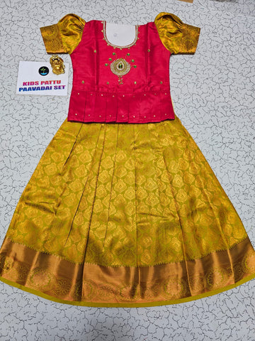 Kids pattu pavadai set with pink semi silk top and yellow bridal silk skirt by Sri Thulir Tex