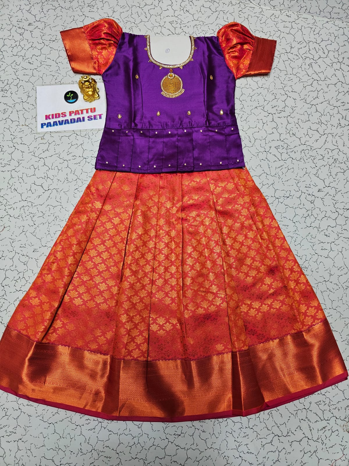 Kids pattu pavadai set with purple semi silk top and orange bridal silk skirt by Sri Thulir Tex