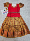 Kids red and gold pattu pavadai set with semi silk blouse and bridal silk skirt by Sri Thulir Tex