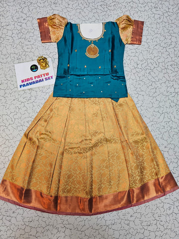 Kids teal blue stone work blouse with gold silk pattu pavadai set by Sri Thulir Tex
