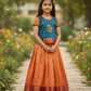 Kids teal blue and orange pattu pavadai set with puff sleeve blouse and zari silk skirt from Sri Thulir Tex