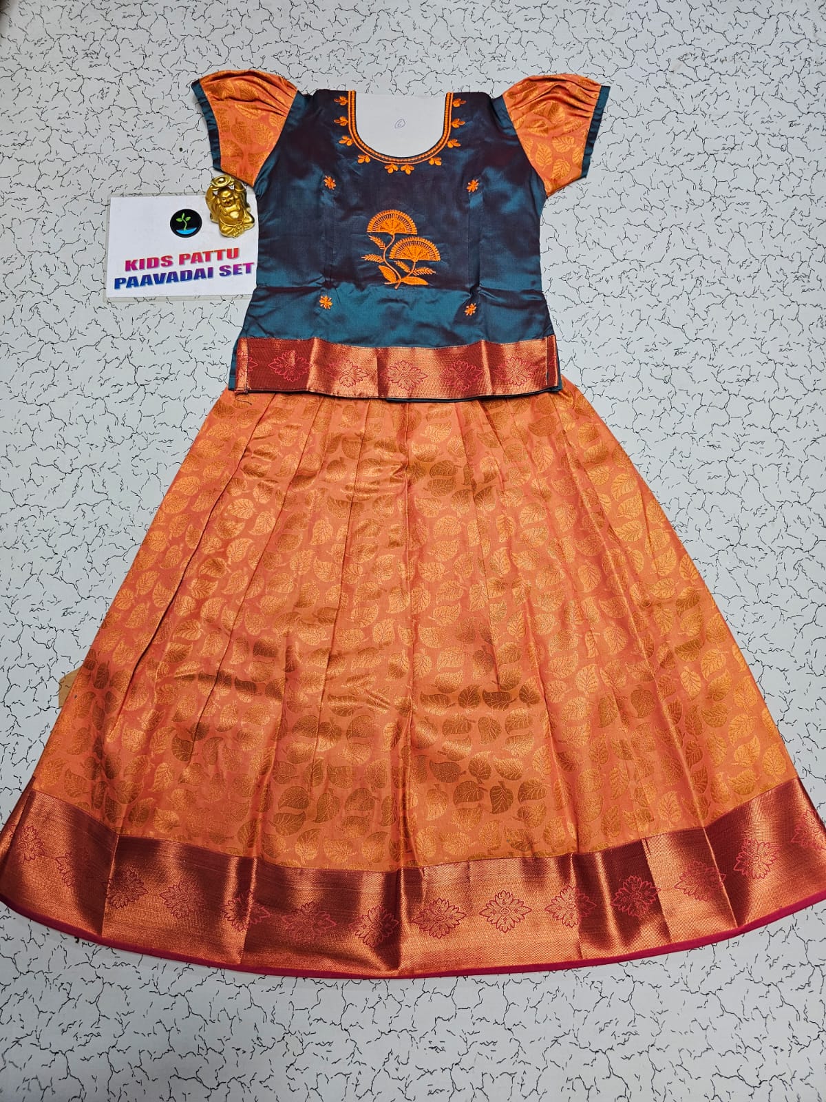 Kids teal blue and orange pattu pavadai set with puff sleeve blouse and zari silk skirt from Sri Thulir Tex