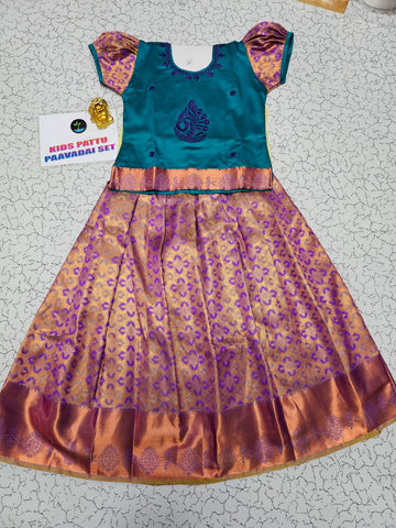 Kids teal green and purple-gold pattu pavadai set with puff sleeves and zari woven skirt from Sri Thulir Tex