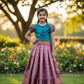 Kids teal green and purple-gold pattu pavadai set with puff sleeves and zari woven skirt from Sri Thulir Tex