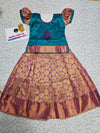 Kids teal green and purple pattu pavadai set with puff sleeve blouse and zari woven skirt from Sri Thulir Tex