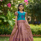 Kids teal green and purple pattu pavadai set with puff sleeve blouse and zari woven skirt from Sri Thulir Tex