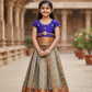 Kids Pattu Pavadai set with violet stone-work top and beige zari woven skirt from Sri Thulir Tex.