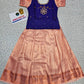 Kids Pattu Pavadai set with violet stone-work top and peach zari woven skirt from Sri Thulir Tex.