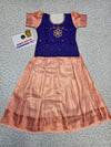 Kids Pattu Pavadai set with violet stone-work top and peach zari woven skirt from Sri Thulir Tex.
