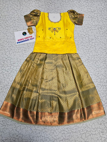 Kids yellow top and gold silk pattu pavadai set from Sri Thulir Tex