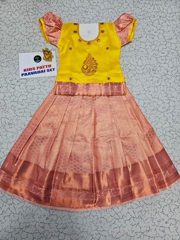 Kids yellow and peach pattu pavadai set with puff sleeve blouse and zari silk skirt from Sri Thulir Tex