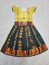 Kids Pattu Pavadai set with yellow stone-work top and dark green zari woven skirt from Sri Thulir Tex.
