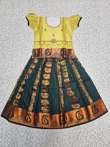 Kids Pattu Pavadai set with yellow stone-work top and dark green zari woven skirt from Sri Thulir Tex.