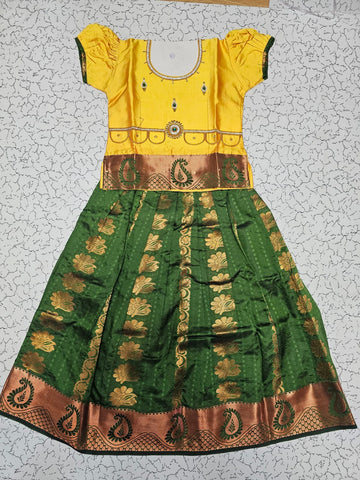Kids Pattu Pavadai set with yellow stone-work top and green zari woven skirt from Sri Thulir Tex.
