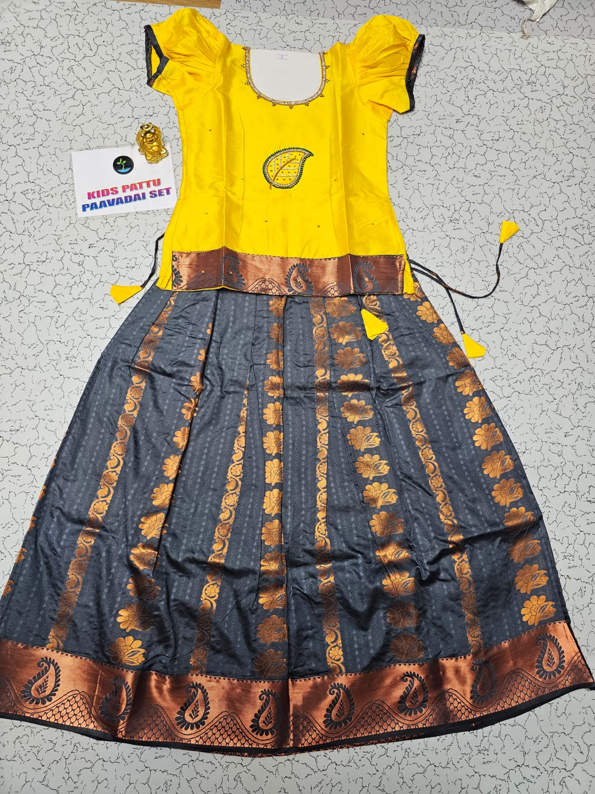 Kids Pattu Pavadai set with yellow stone-work top and grey zari woven skirt from Sri Thulir Tex.
