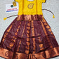 Kids Pattu Pavadai set with yellow stone-work top and maroon zari woven skirt from Sri Thulir Tex.