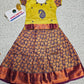 Kids pattu pavadai set with yellow semi-silk top and purple leaf patterned silk skirt by Sri Thulir Tex