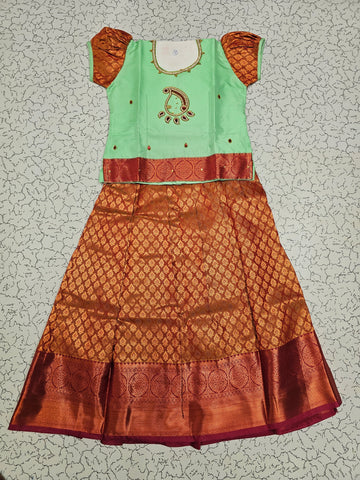 Mint green and copper bridal silk pattu pavadai for kids with puff sleeves and stone work design – Sri Thulir Tex South Indian traditional wear