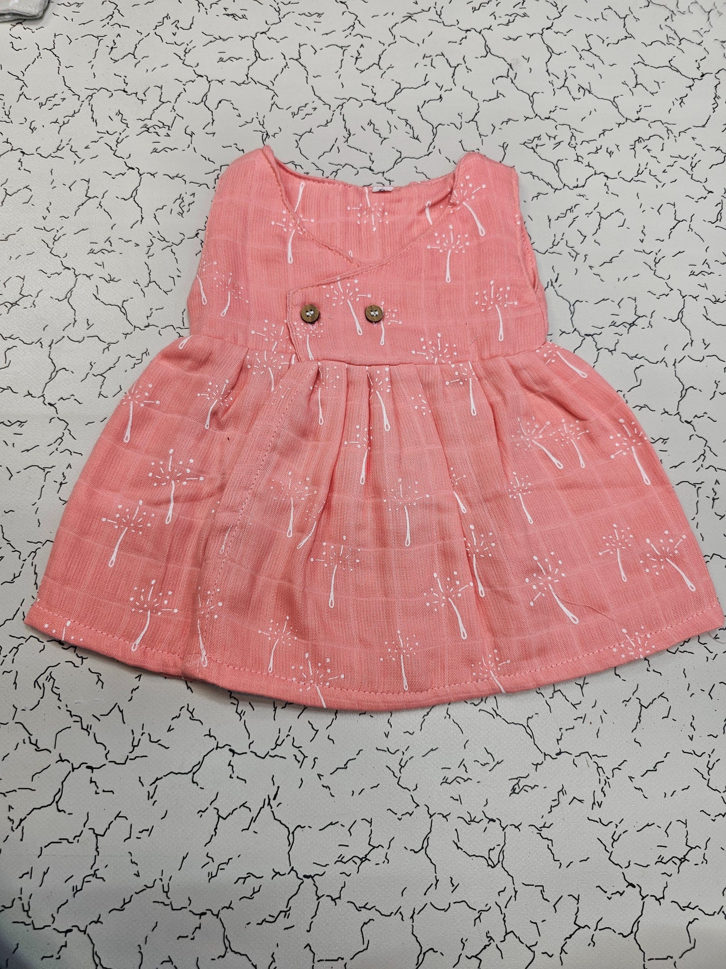 Pink muslin baby jabla frock with white print and button design for 0–6 months – Sri Thulir Tex