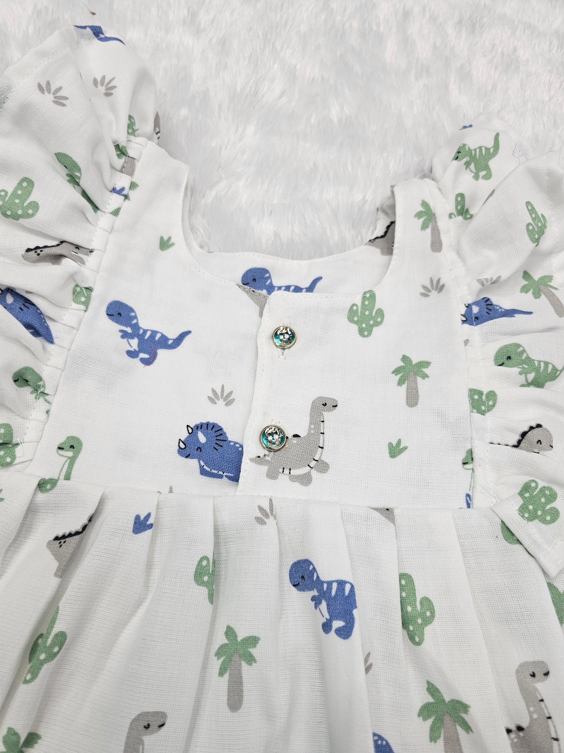 White muslin baby frock with cartoon dinosaur print and butterfly sleeves front open design – Sri Thulir Tex